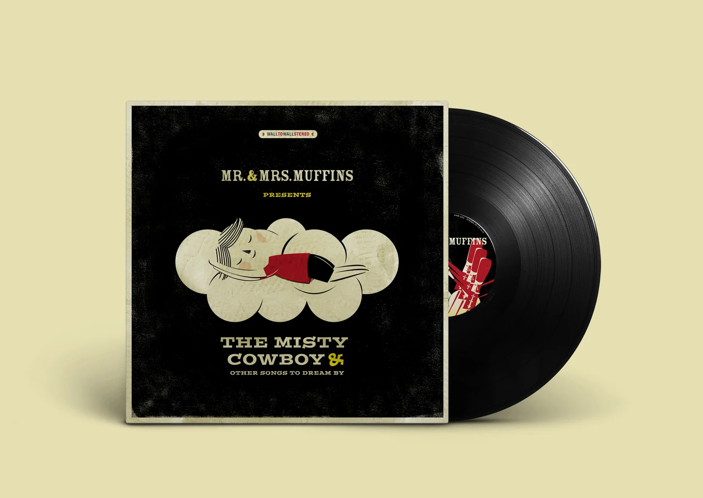 The Mr. & Mrs. Muffins album “The Misty Cowboy & Other Songs to Dream By”: a dark textured sleeve with a sleeping cowboy curled on a cloud, beside its black vinyl record.